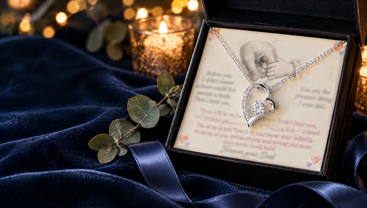Silver heart necklace in a black gift box on navy velvet